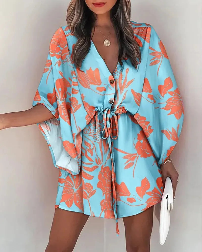 Stylish, tropical-inspired mini dress with a relaxed yet elegant vibe.