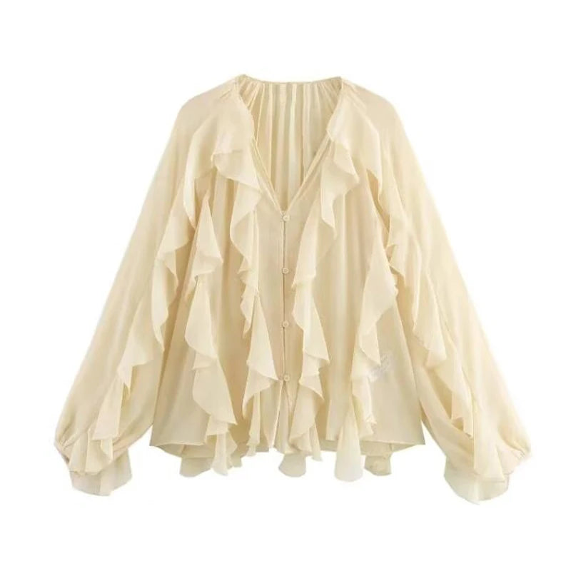 Boho Ruffle Chiffon Blouse- Boho-inspired chiffon blouse in a rich deep wine hue. Designed with layered ruffle detailing throughout the front and billowy long sleeves, this blouse brings an elegant, vintage flair to any outfit.