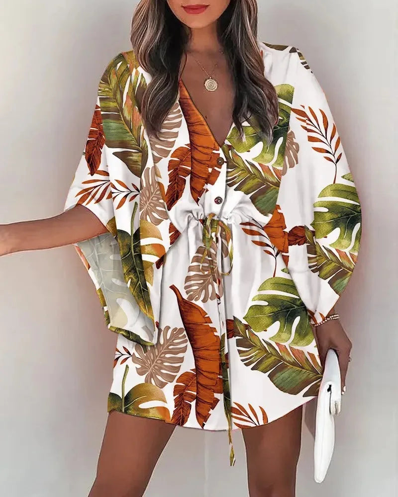 Stylish, tropical-inspired mini dress with a relaxed yet elegant vibe.