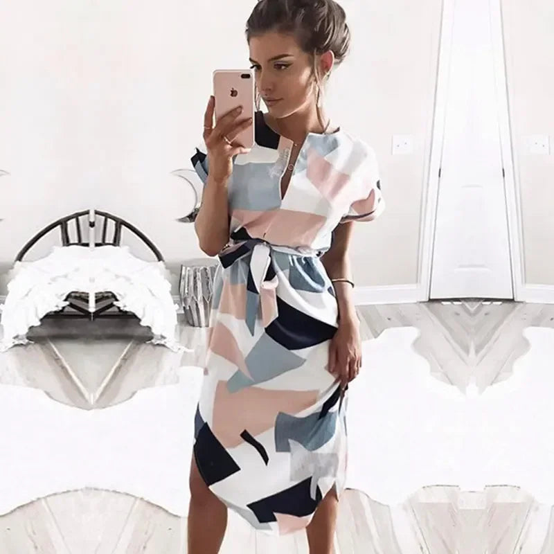 Step into effortless elegance with our Abstract Chic Belted Midi Dress