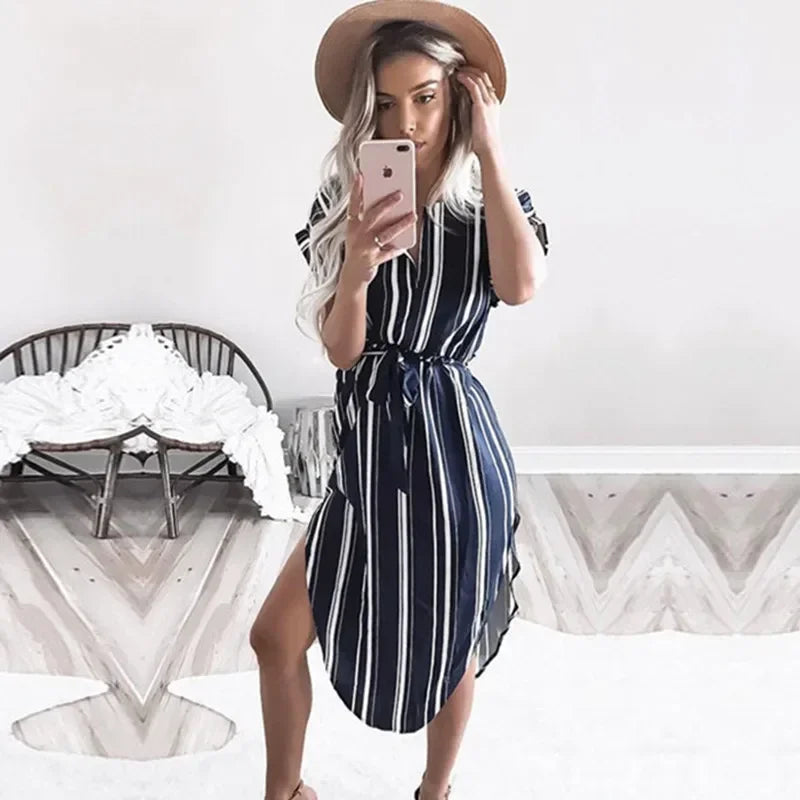 Step into effortless elegance with our Abstract Chic Belted Midi Dress