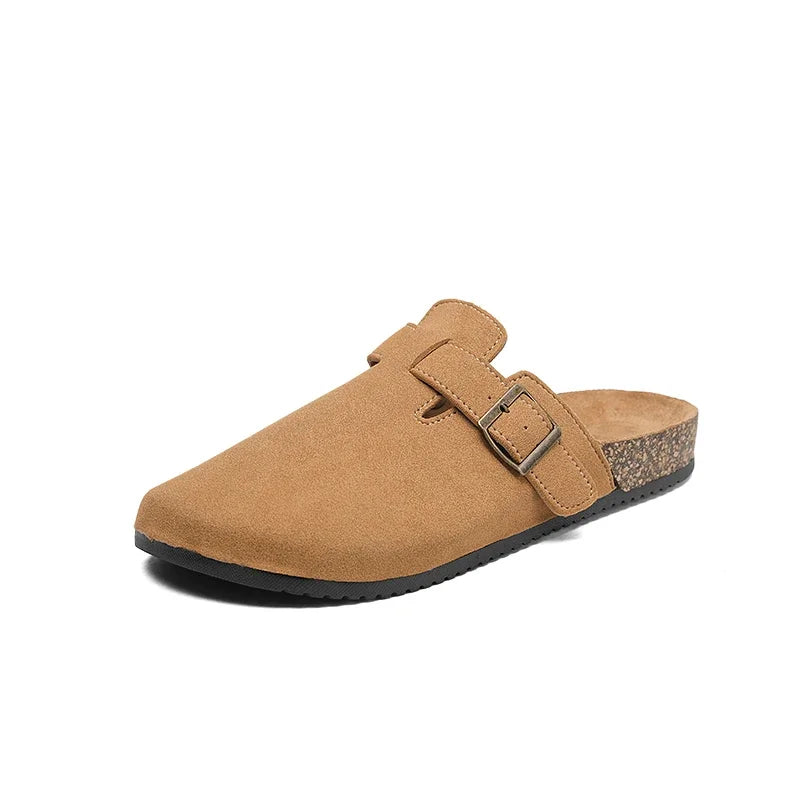 Casual slip-on clogs. Featuring a soft suede-like upper, contoured cork footbed, and an adjustable buckle strap
