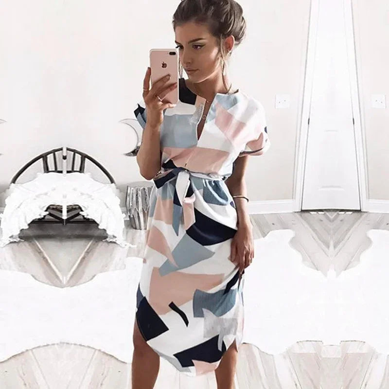 Step into effortless elegance with our Abstract Chic Belted Midi Dress