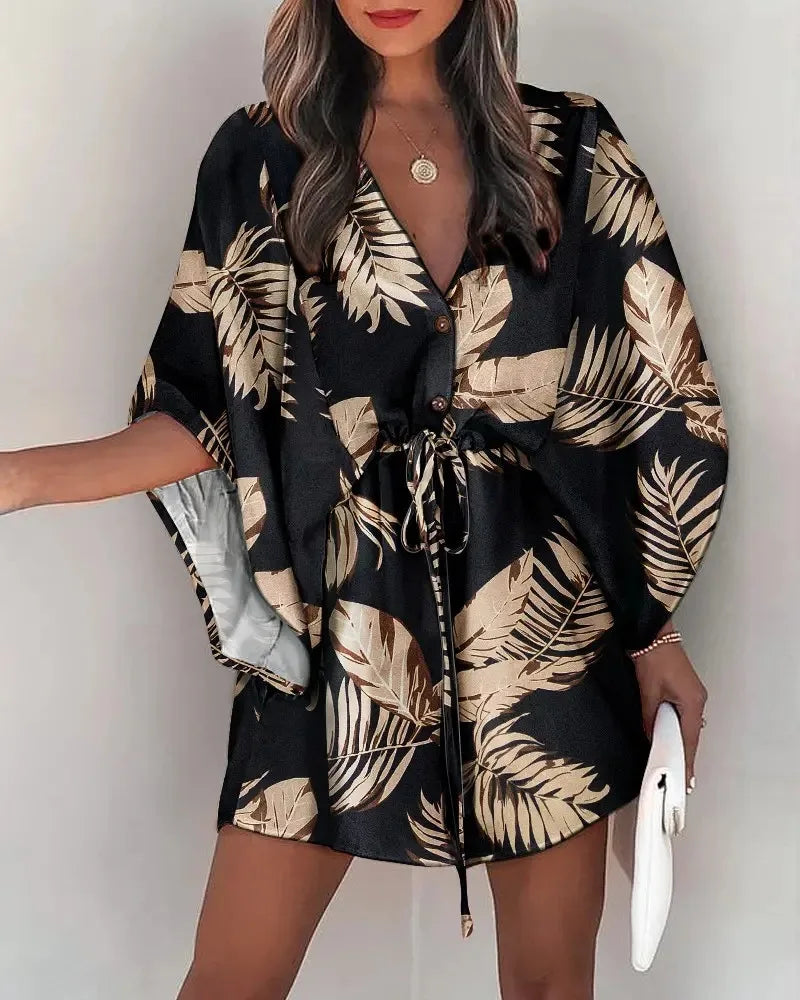 Stylish, tropical-inspired mini dress with a relaxed yet elegant vibe.