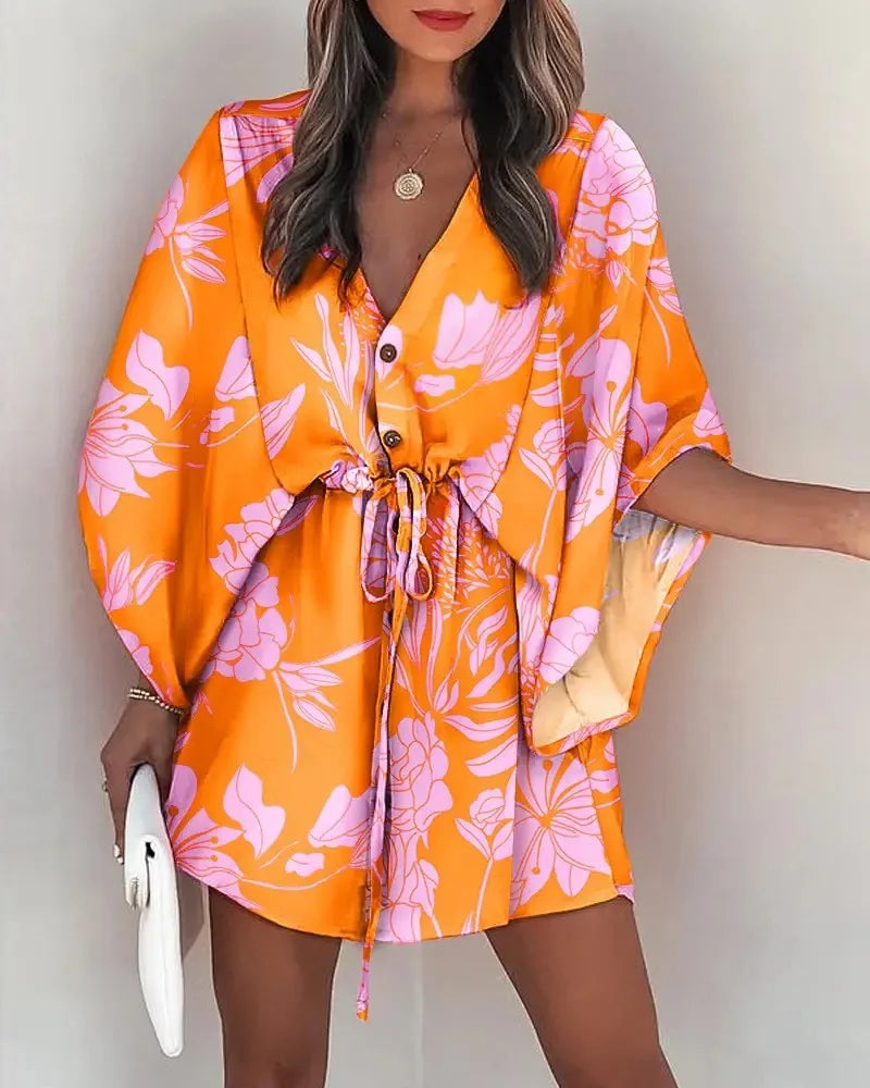 Stylish, tropical-inspired mini dress with a relaxed yet elegant vibe.