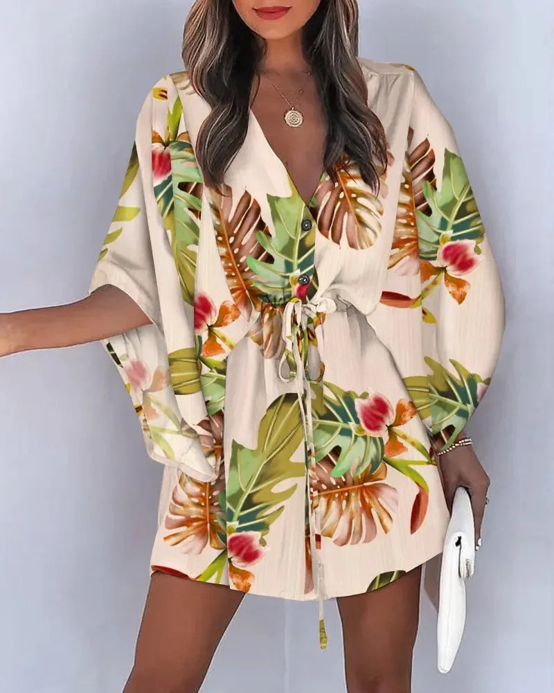 Stylish, tropical-inspired mini dress with a relaxed yet elegant vibe.