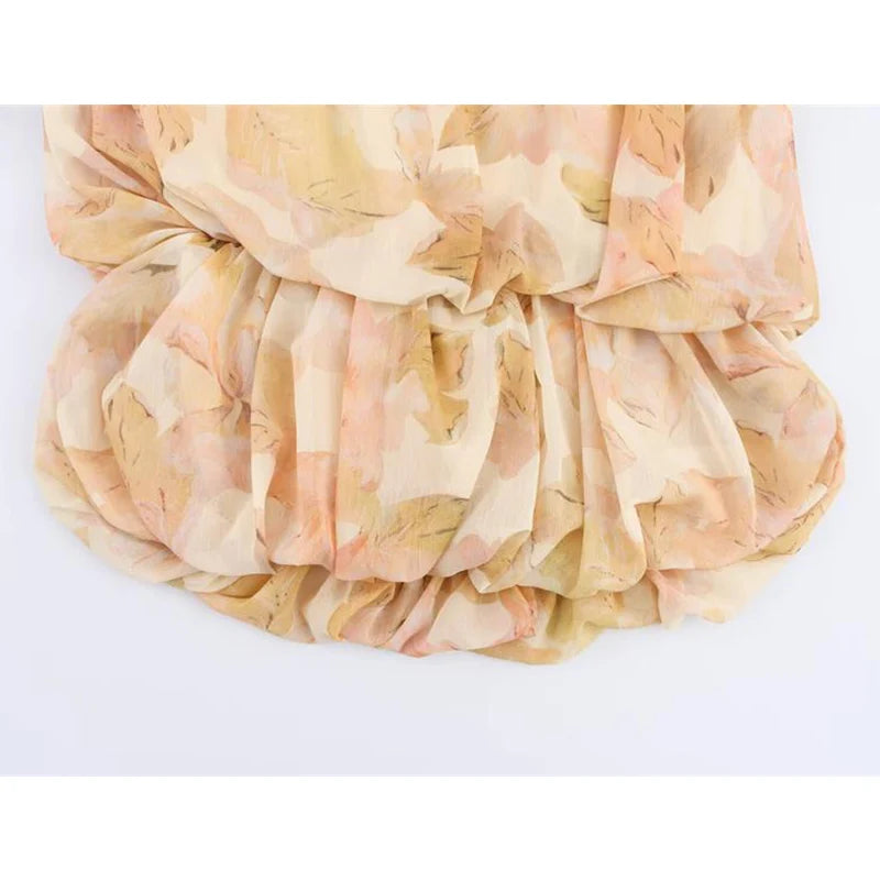 Boho-Chic Floral Pleated Two-Piece Set – Romantic Ruffle Blouse & Mini Skirt  Turn heads this season with our Boho-Chic Floral Pleated Two-Piece Set, a dreamy blend of elegance and carefree charm.